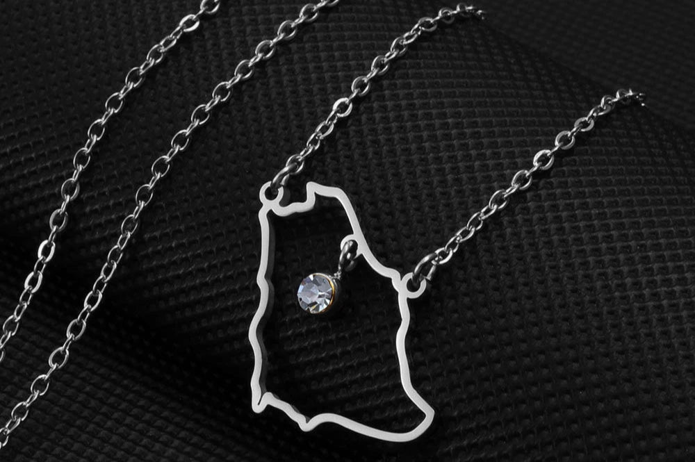 Saudi Arabia map pendant necklace with clear gemstone.