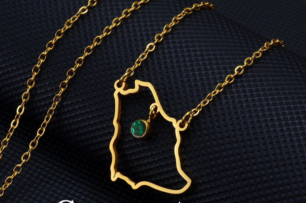 Gold Saudi Arabia map necklace with gemstone.